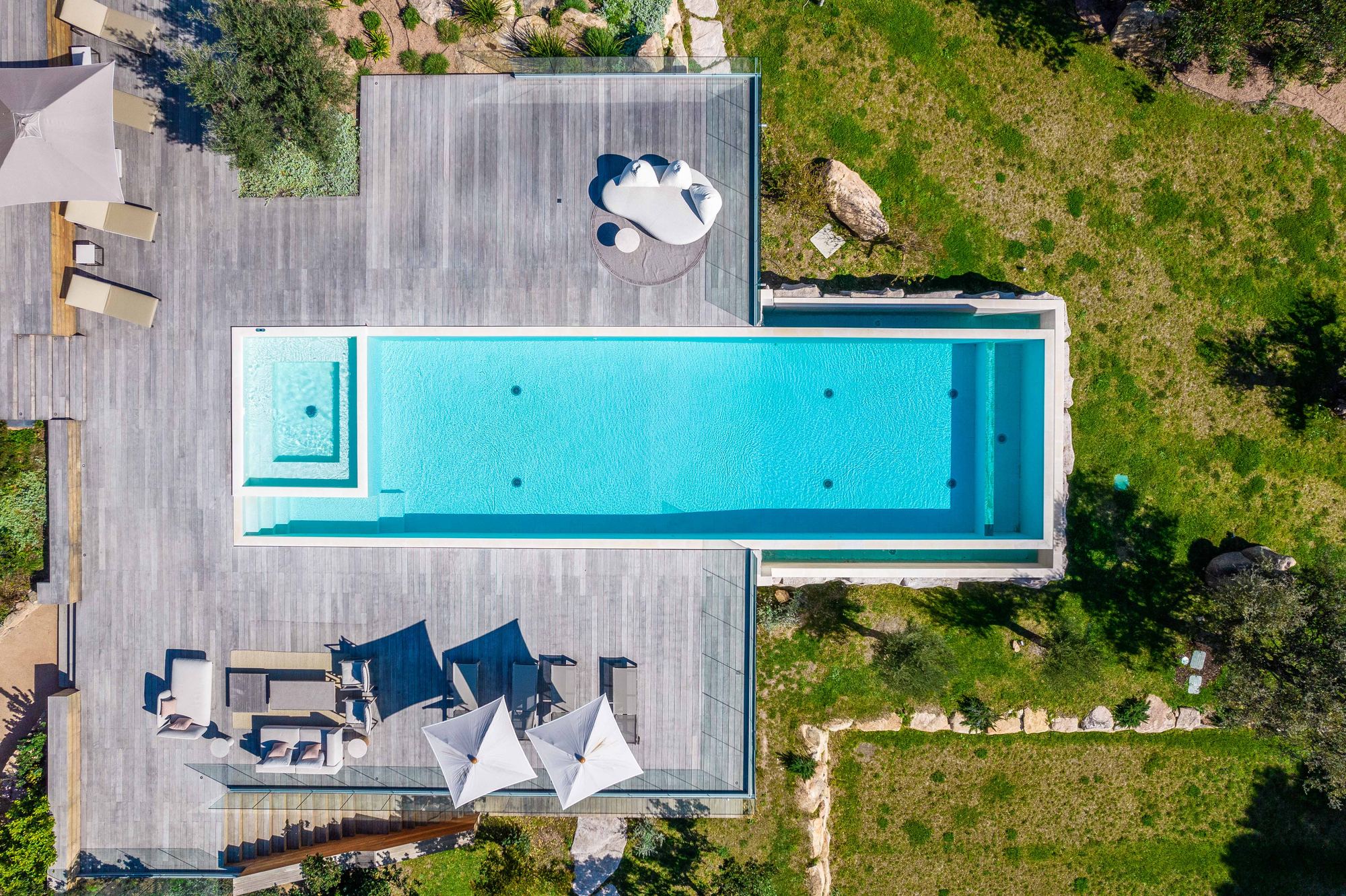 Top-down aerial of the pool terrace and grounds