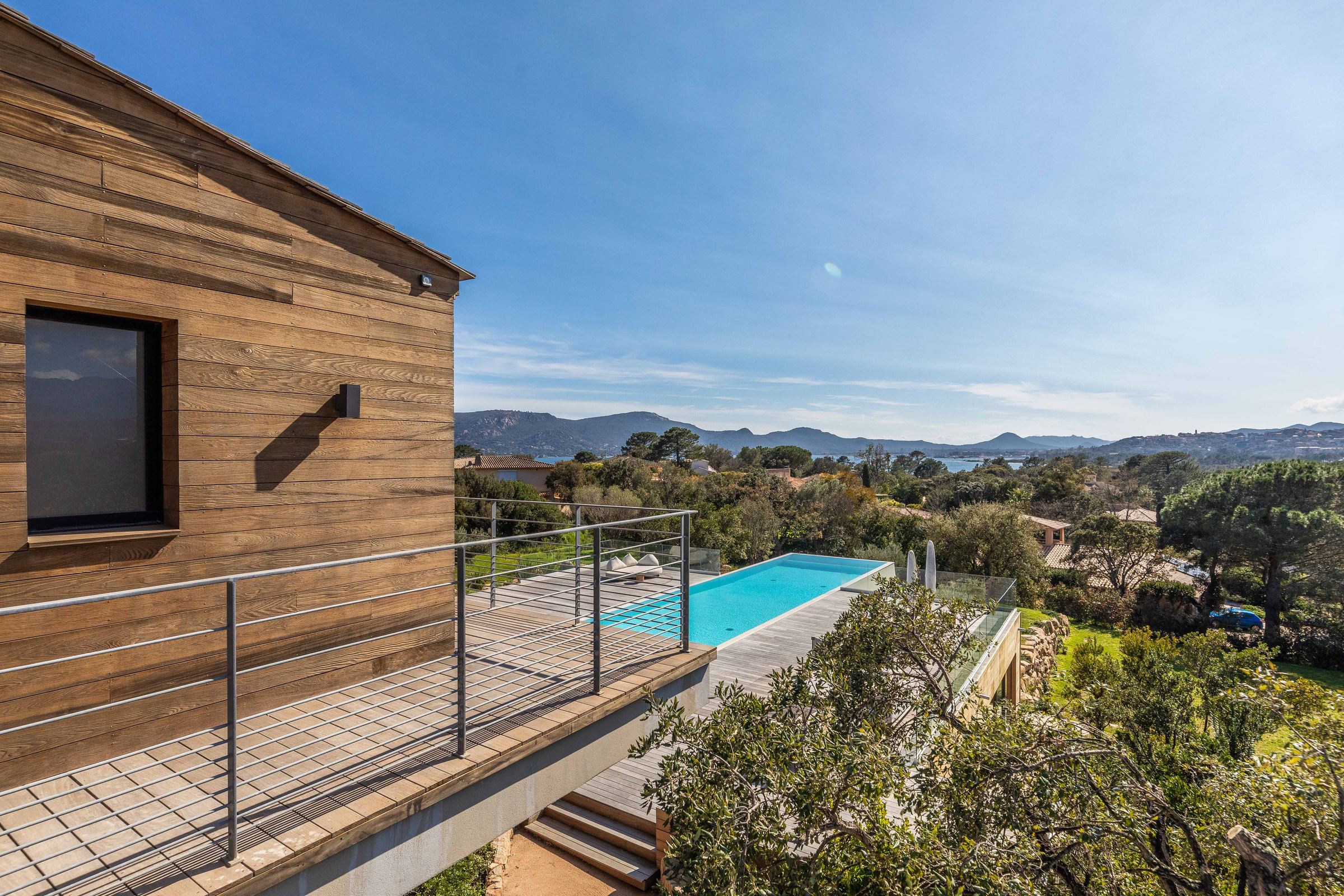 Cedar-clad façade and the pool