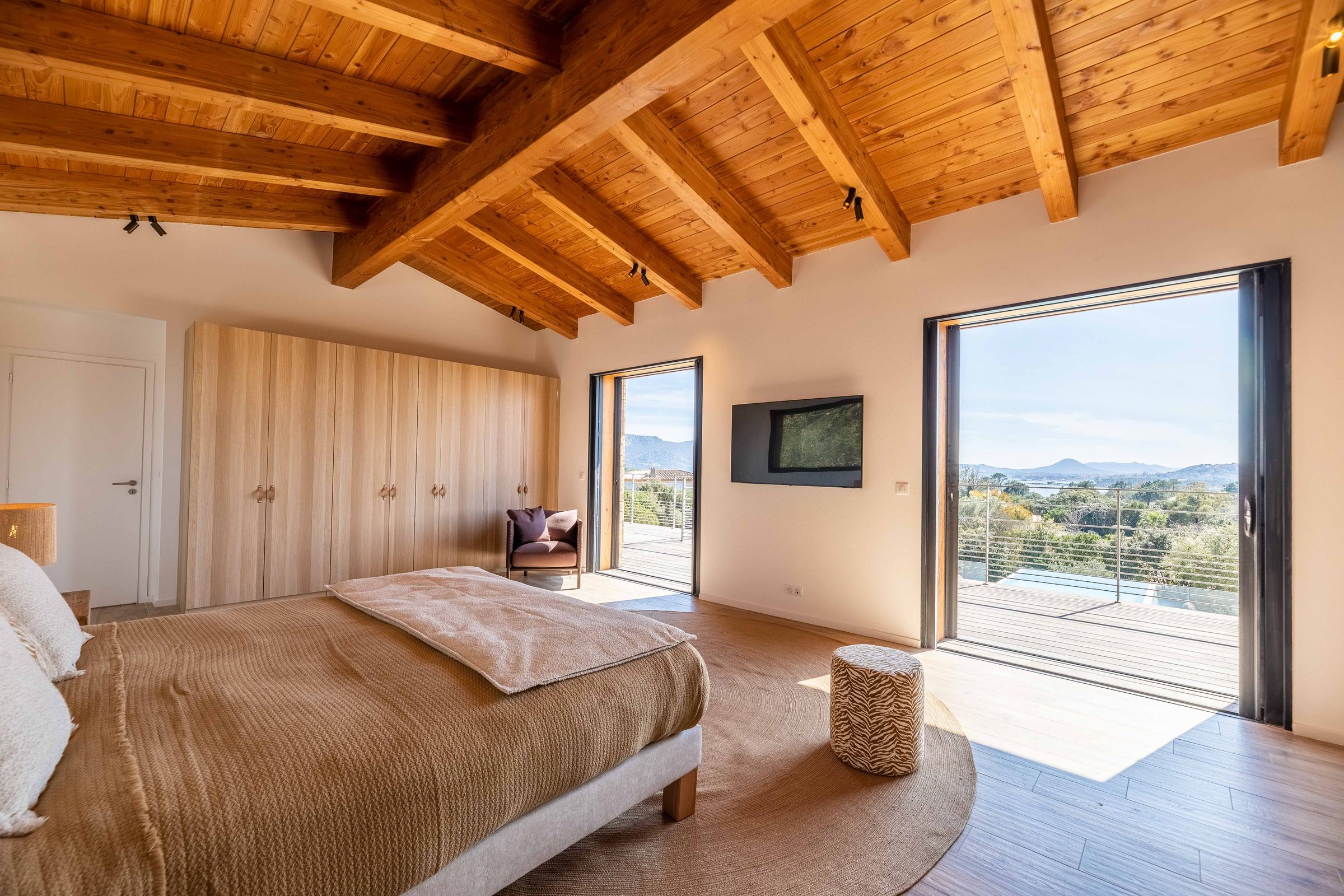 Primary suite opening onto the terrace and the view